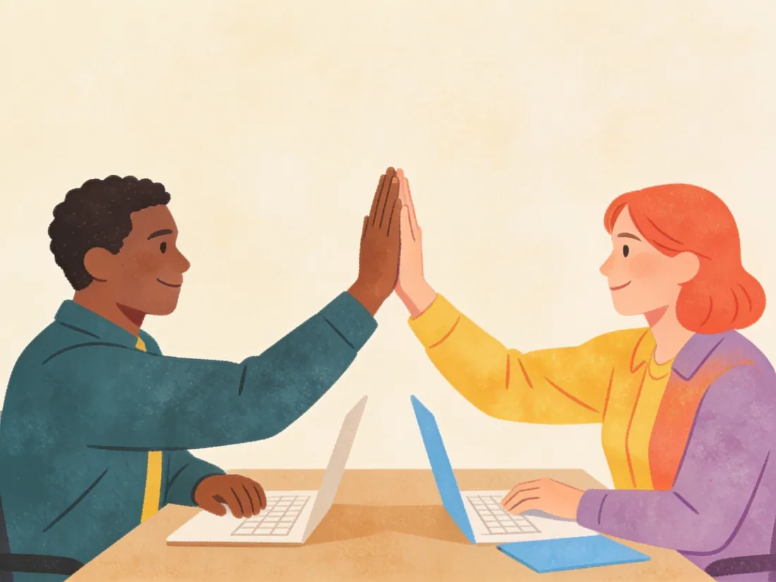 Two people giving a high five at the end of a work session.